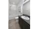 Well-maintained bathroom with a shower-tub combination and a granite-topped vanity at 3726 Shaving Shadows Ave, North Las Vegas, NV 89032