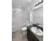 Well-maintained bathroom with a shower-tub combination and a granite-topped vanity at 3726 Shaving Shadows Ave, North Las Vegas, NV 89032