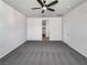 Spacious bedroom featuring neutral carpeting and a ceiling fan for added comfort at 3726 Shaving Shadows Ave, North Las Vegas, NV 89032