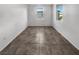 Bright bedroom featuring tile flooring and a window providing natural light at 3726 Shaving Shadows Ave, North Las Vegas, NV 89032