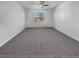 Spacious bedroom with neutral carpet and a ceiling fan at 3726 Shaving Shadows Ave, North Las Vegas, NV 89032