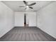 Large bedroom featuring neutral carpet, a ceiling fan, and ample space at 3726 Shaving Shadows Ave, North Las Vegas, NV 89032
