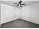 Bright bedroom with a ceiling fan, carpeted floor, and freshly painted walls at 3726 Shaving Shadows Ave, North Las Vegas, NV 89032