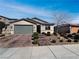 Charming single-story home featuring a low-maintenance front yard and a two-car garage at 3726 Shaving Shadows Ave, North Las Vegas, NV 89032