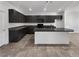 Well-equipped kitchen with dark cabinets, granite countertops, and an island with bar seating at 3726 Shaving Shadows Ave, North Las Vegas, NV 89032