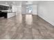 Open-concept living space with tile flooring, connecting the kitchen and dining areas at 3726 Shaving Shadows Ave, North Las Vegas, NV 89032