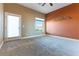 Spacious bedroom features neutral colors, a ceiling fan and plenty of natural light with views of the surrounding landscape at 380 Claremont St, Boulder City, NV 89005