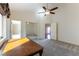 This large bedroom features carpet flooring and offers views to both the bathroom and entryway at 380 Claremont St, Boulder City, NV 89005