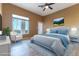 Bright bedroom featuring a tufted headboard, mountain view and a calming color palette at 380 Claremont St, Boulder City, NV 89005