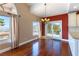 Dining room with hardwood floors, chandelier, and sliding doors to the outside at 380 Claremont St, Boulder City, NV 89005