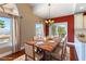 Bright dining area with mountain views, slider to patio, and granite counters nearby at 380 Claremont St, Boulder City, NV 89005