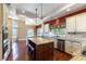 Spacious kitchen with a central island, stainless steel appliances, and lake views at 380 Claremont St, Boulder City, NV 89005