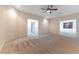 Inviting living room featuring neutral carpet and views into other rooms at 380 Claremont St, Boulder City, NV 89005