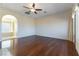 Large space with hardwood floors, bright walls, an archway and natural light streaming in at 380 Claremont St, Boulder City, NV 89005