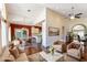 Open-concept living area with hardwood floors, a dining area, and comfortable seating at 380 Claremont St, Boulder City, NV 89005