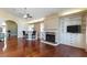 Bright living room featuring a fireplace, built-ins, and hardwood floors at 380 Claremont St, Boulder City, NV 89005