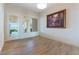 Bright living room featuring wood floors, a patio door, and elegant decor at 380 Claremont St, Boulder City, NV 89005