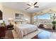 Spacious main bedroom features a balcony, hardwood floors, and decorative ceiling at 380 Claremont St, Boulder City, NV 89005