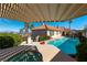 Backyard pool and spa with a covered patio area and mountain views at 380 Claremont St, Boulder City, NV 89005