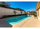 Inviting backyard pool featuring a sunny patio area with lush landscaping at 380 Claremont St, Boulder City, NV 89005