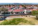 An aerial view of the backyard of the property with block wall and neighboring houses in the community at 4032 Bola Dr, North Las Vegas, NV 89032