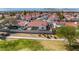 An aerial view of the backyard of the property with block wall and neighboring houses in the community at 4032 Bola Dr, North Las Vegas, NV 89032