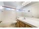 Bathroom featuring a tub, shower, and single vanity, with tile flooring at 4032 Bola Dr, North Las Vegas, NV 89032
