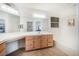 This bathroom offers ample counter space, an integrated vanity, and neutral colors at 4032 Bola Dr, North Las Vegas, NV 89032