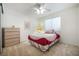 Comfortable bedroom features neutral carpet, dresser, and a window providing natural light at 4032 Bola Dr, North Las Vegas, NV 89032