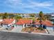 Charming single-story home featuring a red tile roof, a well-manicured front yard and an attached two car garage at 4032 Bola Dr, North Las Vegas, NV 89032