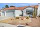 A single-story home with a well-maintained front yard and attached two-car garage at 4032 Bola Dr, North Las Vegas, NV 89032