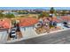 Charming single-story home featuring a red tile roof, a well-manicured front yard and an attached two car garage at 4032 Bola Dr, North Las Vegas, NV 89032