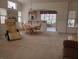 Inviting living room flows into the dining area, featuring an arched entryway to the kitchen at 4032 Bola Dr, North Las Vegas, NV 89032