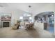 Living room featuring dining area with views of kitchen and fireplace provides flexible living space at 4032 Bola Dr, North Las Vegas, NV 89032