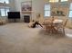 Spacious living area with fireplace, dining area, and comfortable seating in a bright setting at 4032 Bola Dr, North Las Vegas, NV 89032