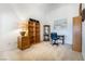 Home office with shelving, desk, and carpet flooring, perfect for work or study at 4032 Bola Dr, North Las Vegas, NV 89032