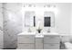Bright bathroom with double vanity, modern lighting, and stylish white marble wall tiles at 4308 San Bernardino Ave, Las Vegas, NV 89102