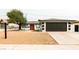 Charming single story home with a freshly landscaped front yard, long driveway, and stylish black and white exterior at 4308 San Bernardino Ave, Las Vegas, NV 89102