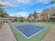 Outdoor basketball court surrounded by trees and residential buildings at 4615 Puglia Ln # 201, North Las Vegas, NV 89084