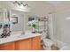 Bathroom features a single sink vanity, large mirror, and shower over tub at 4615 Puglia Ln # 201, North Las Vegas, NV 89084