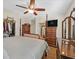 Spacious bedroom features hardwood floors, ceiling fan, and ample closet space at 4615 Puglia Ln # 201, North Las Vegas, NV 89084