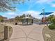 Community playground and picnic area surrounded by walkways and residential buildings at 4615 Puglia Ln # 201, North Las Vegas, NV 89084