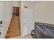 A carpeted staircase with wooden railing leads to the upper level of the home at 4615 Puglia Ln # 201, North Las Vegas, NV 89084