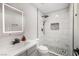 Modern bathroom with an illuminated mirror and a stand-up shower featuring white tile and decorative accents at 5097 Indian River Dr # 172, Las Vegas, NV 89103