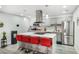 Bright kitchen with a kitchen island with seating, stainless steel appliances, and modern countertops at 5097 Indian River Dr # 172, Las Vegas, NV 89103