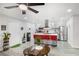 Open-concept living space with modern fixtures, an island with seating, and lots of natural light at 5097 Indian River Dr # 172, Las Vegas, NV 89103