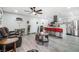 Open-concept space with the kitchen featuring an island and stainless steel appliances, and a casual seating area at 5097 Indian River Dr # 172, Las Vegas, NV 89103