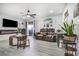 Bright living room showcasing modern flooring, a linear fireplace, and comfortable seating arrangement at 5097 Indian River Dr # 172, Las Vegas, NV 89103