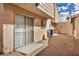 Private backyard with low-maintenance landscaping and a sliding glass door for easy access at 5157 Garden Ln # F, Las Vegas, NV 89119