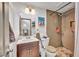 Functional bathroom featuring a vanity sink and a stand up shower with unique tiling at 5157 Garden Ln # F, Las Vegas, NV 89119